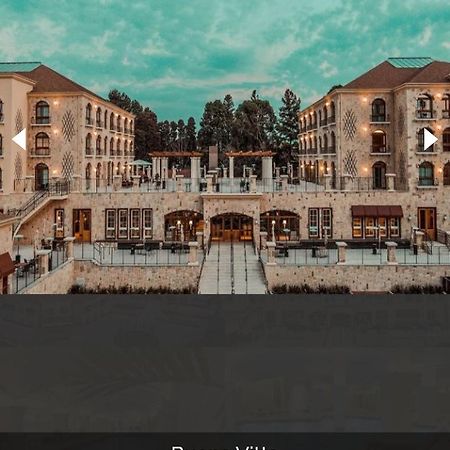 Buona Vitta Gramado Resort & Spa By Gramado Parks Bagian luar foto The photo shows a spacious and elegant building design, likely a hotel or resort. The structure features multiple stories and large windows, with outdoor seating areas visible on a terrace or patio. The exterior has a combination of stone and modern 